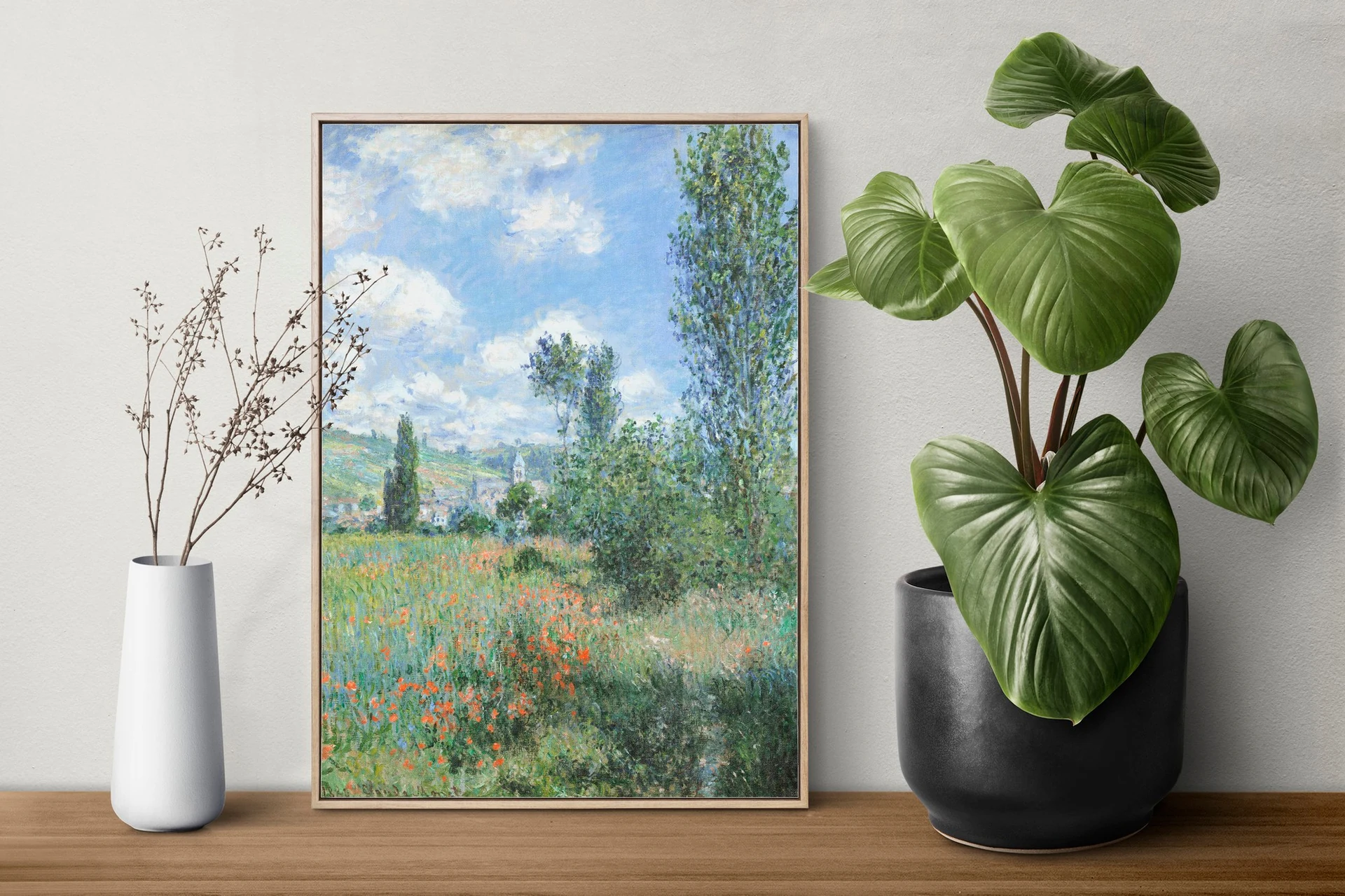 Interior with framed landscape art and plants